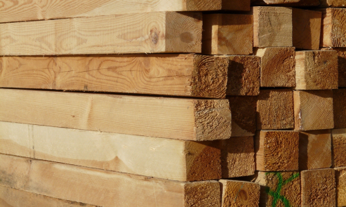 Stacked treated lumber.